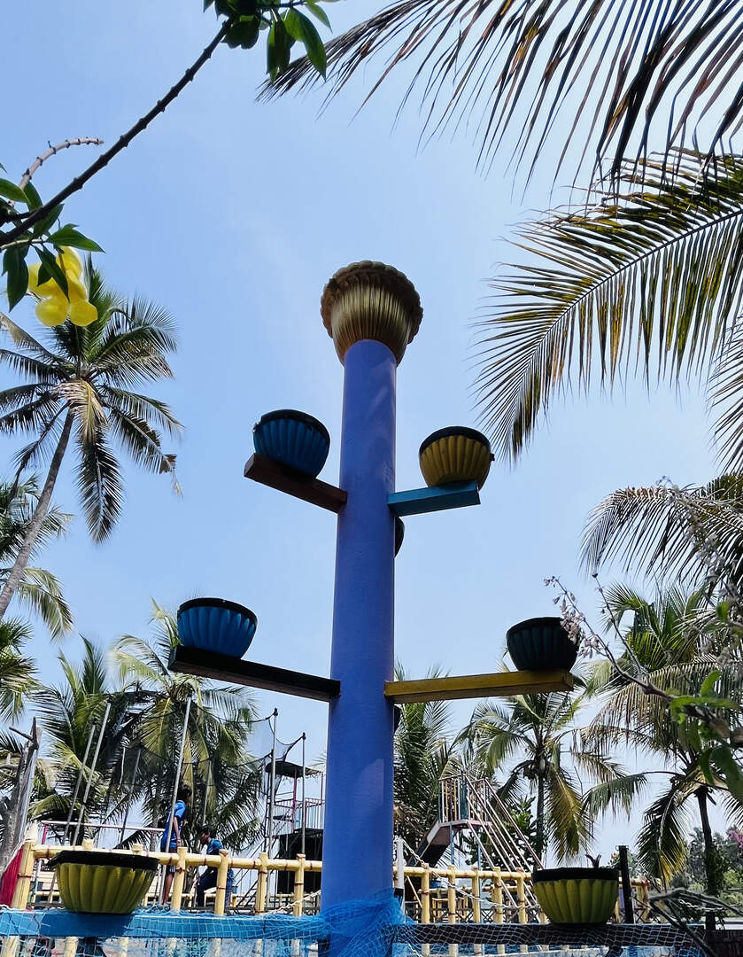 Art installation with cascading water pots at the park